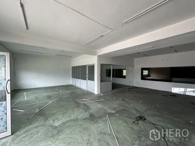 Factory for rent or sale in Khlong Luang, Pathum Thani - Upper-floor office space with partitioned rooms and fluorescent lighting.
