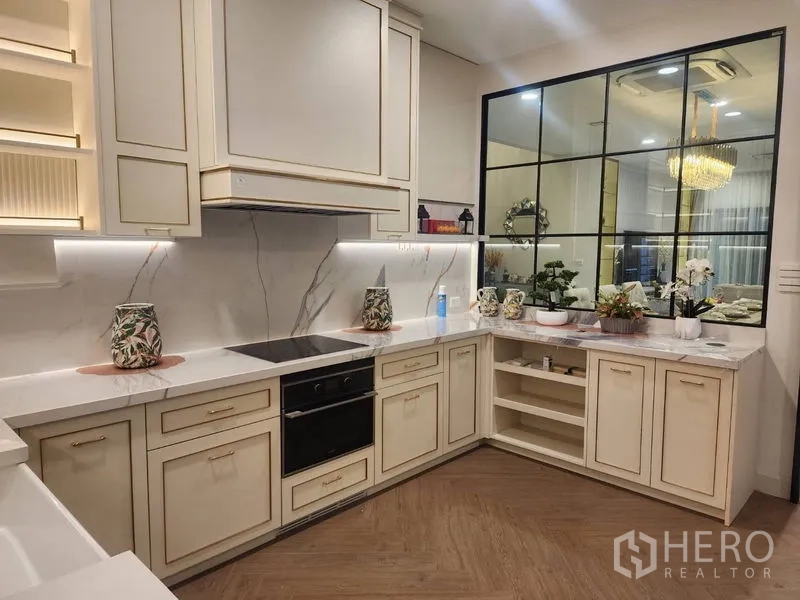 Detached House for rent or sale - Show kitchen with marble countertops, open shelving and a window to the dining room