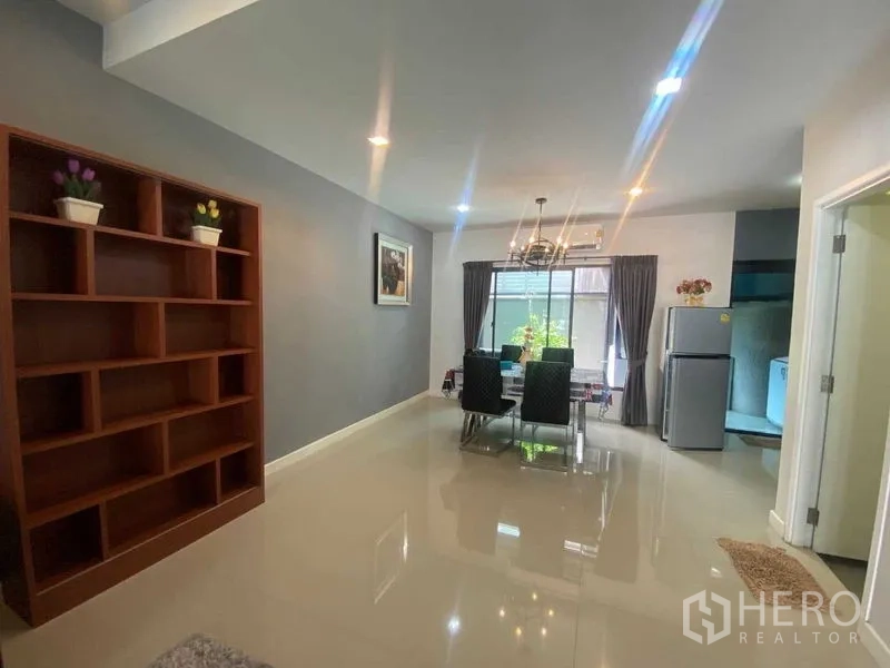Home Office for rent or sale in Bang Phli, Samut Prakan - Dining zone with large window, curtains, and fridge beside the kitchen.