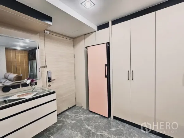 Condominium for sale in Bang Rak, Bangkok - Entry hall with full-height wardrobes, digital door lock and gray marble tiles in a Bangkok condo.