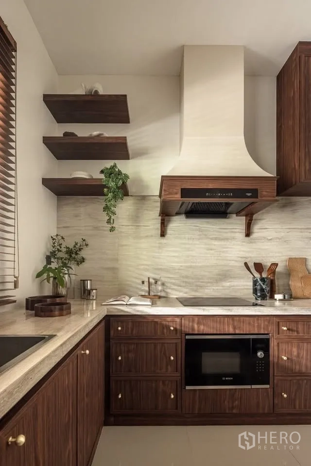 Detached House for rent or sale in Lat Krabang, Bangkok - U-shaped kitchen with wood cabinets, stone counters, range hood, and open shelves.