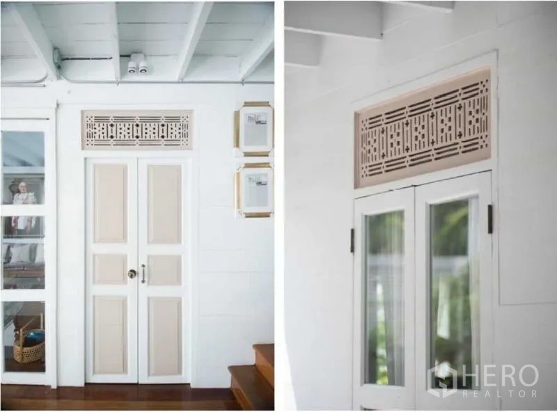 Detached House for rent in Bang Rak, Bangkok - Close-up of decorative transom panels above interior and exterior doors.
