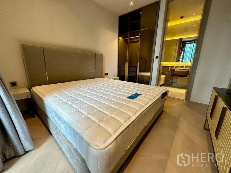 Condominium for rent - Bedroom with built-in wardrobe leading to an ensuite bathroom.