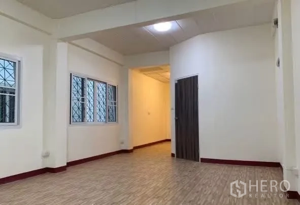 Home Office for rent in Sathon, Bangkok - Bright open room with wood flooring and interior doors.