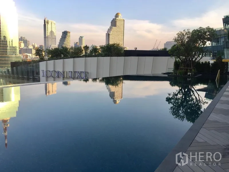 Condominium for sale in Khlong San, Bangkok - Riverside infinity-edge pool at ICONLUXE with reflections of the Bangkok skyline.