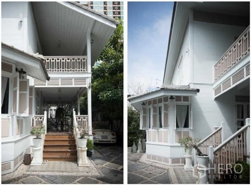 Detached House for rent in Bang Rak, Bangkok - Covered front porch with wooden steps and balcony railings, plus a shaded driveway.