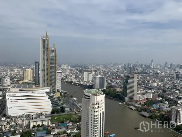 Condominium for rent or sale in Khlong San, Bangkok - Panoramic view of the Chao Phraya River, ICONSIAM and Bangkok skyline from a high-floor condo.