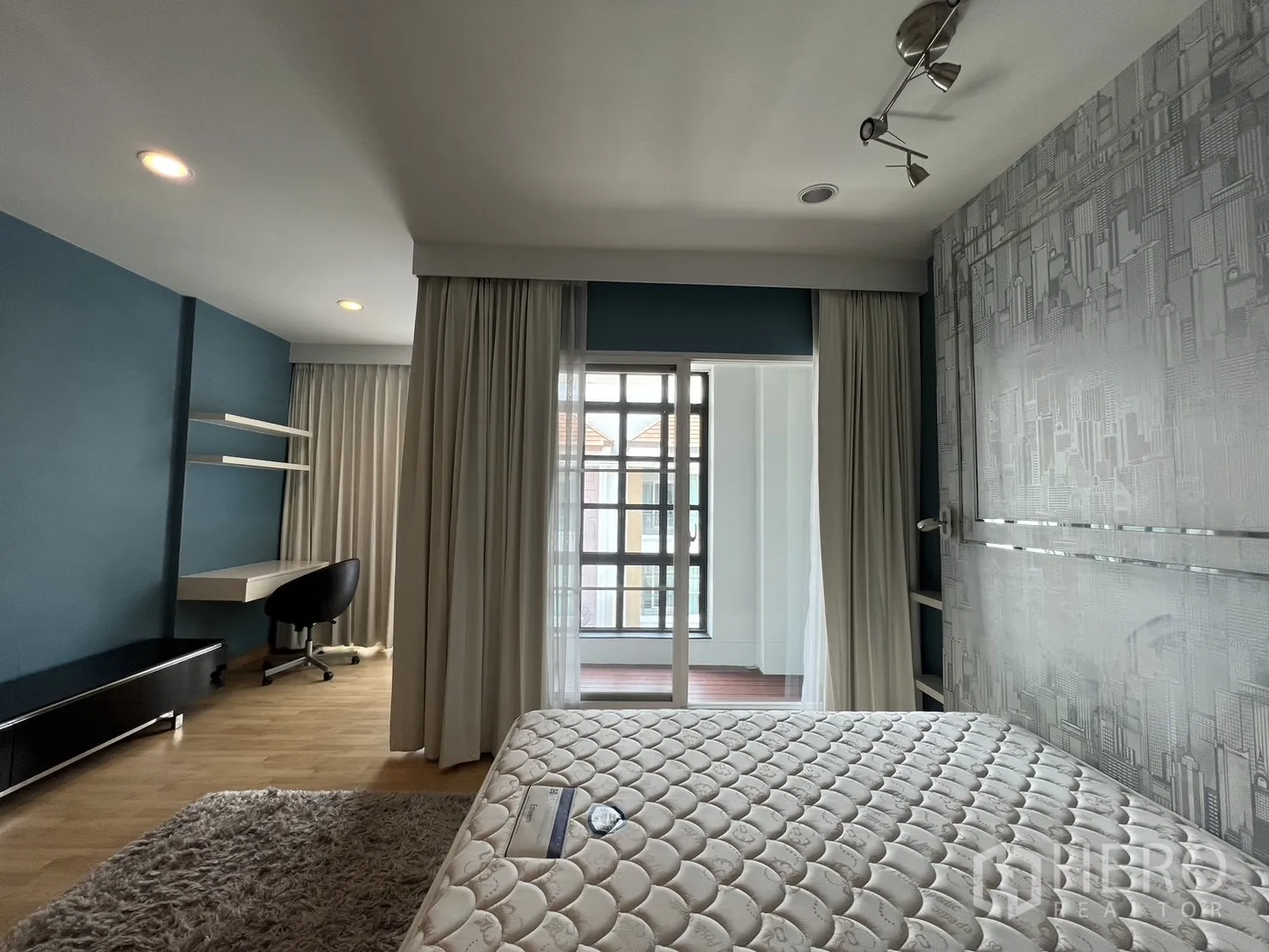 Townhouse for rent in Wang Thonglang, Bangkok - Bedroom view to enclosed balcony with sliding glass door.