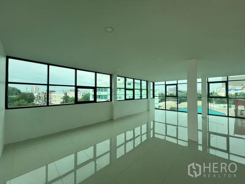 Office Space for rent or sale in Wang Thonglang, Bangkok - Corner office zone with panoramic windows and Bangkok views.