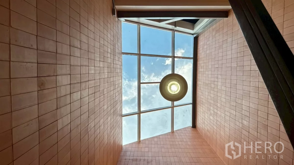 Home Office for rent in Watthana, Bangkok - Atrium skylight with circular pendant bringing daylight into the stair core.