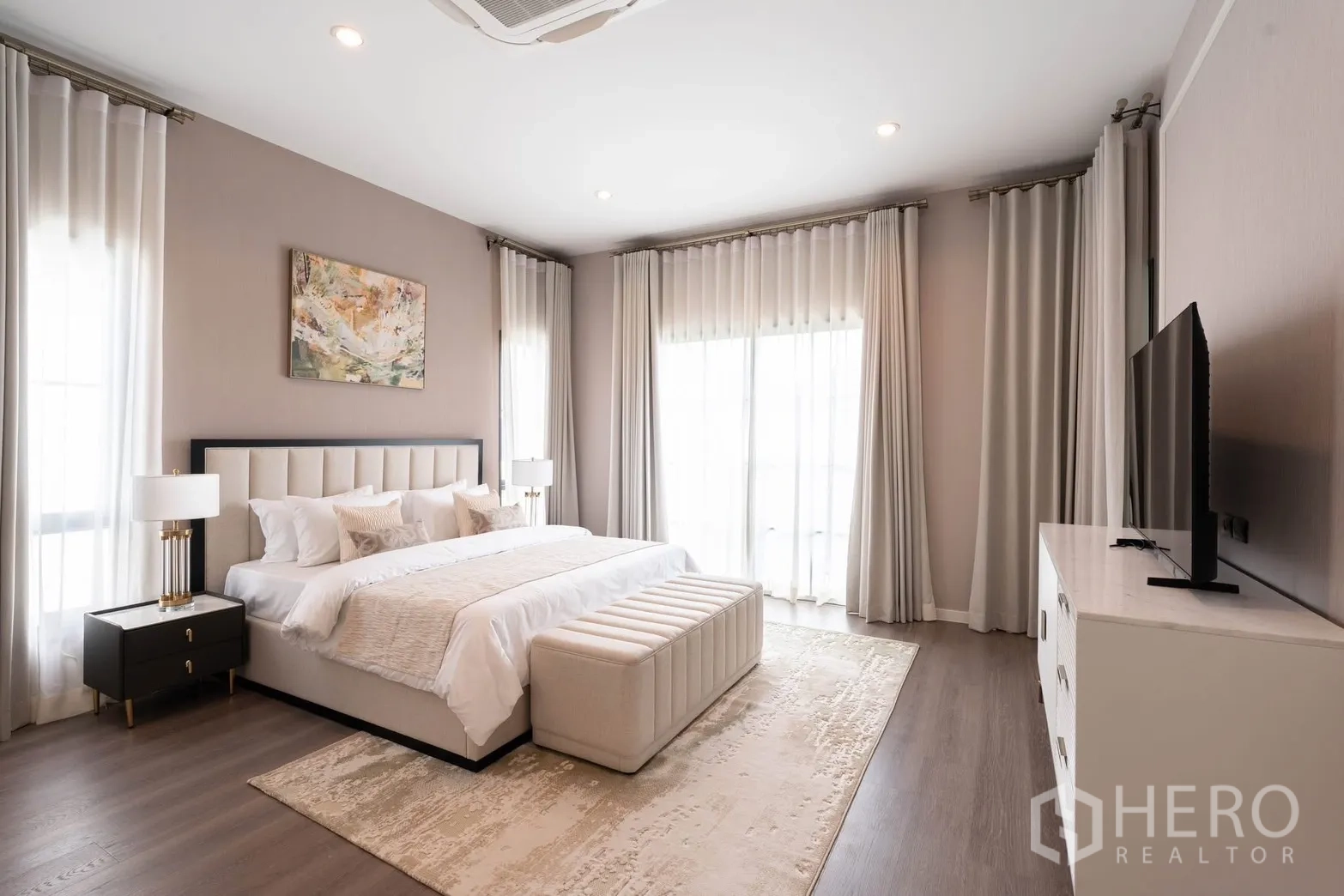 Detached House for rent in Bang Phli, Samut Prakan - Master bedroom view with large windows, sheer curtains, and TV cabinet.