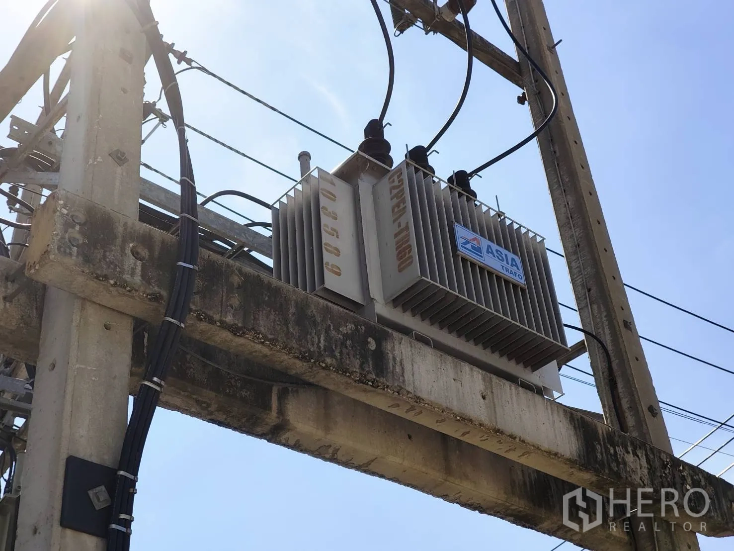 Factory for rent in Krathum Baen, Samut Sakhon - Outdoor electrical transformer mounted on a utility pole.
