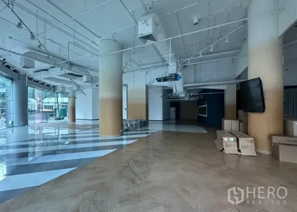 Office Space for rent - Expansive ground-floor space with columns, ducted air-conditioning, striped tile entry and glass frontage.