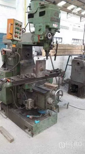 Warehouse for rent or sale in Nong Suea, Pathum Thani - Close-up of a green milling machine inside the factory hall.