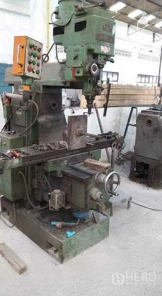 Warehouse for rent or sale in Nong Suea, Pathum Thani - Close-up of a green milling machine inside the factory hall.