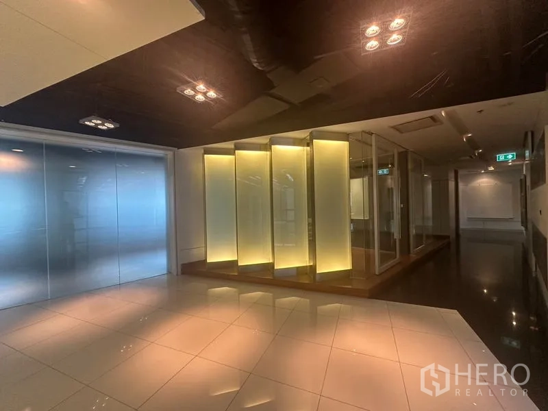 Office Space for rent in Khlong Toei, Bangkok - Lobby zone with illuminated vertical panels and glass meeting rooms.