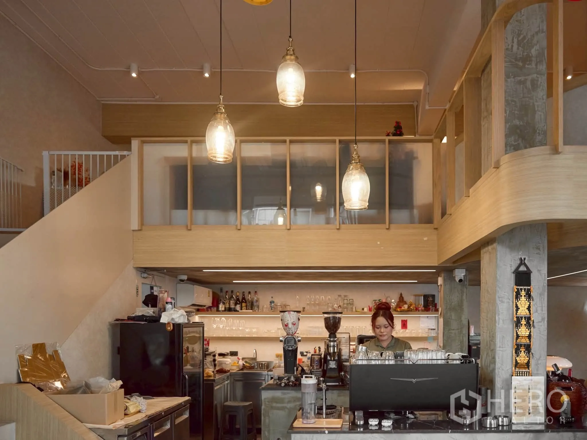 Retail Space for rent in Watthana, Bangkok - Barista station beneath the mezzanine with pendant lights and shelving.