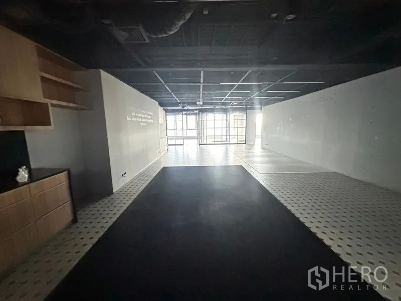 Office Space for rent in Bang Rak, Bangkok - Reception or lounge area with built-in shelves and patterned tile flooring.