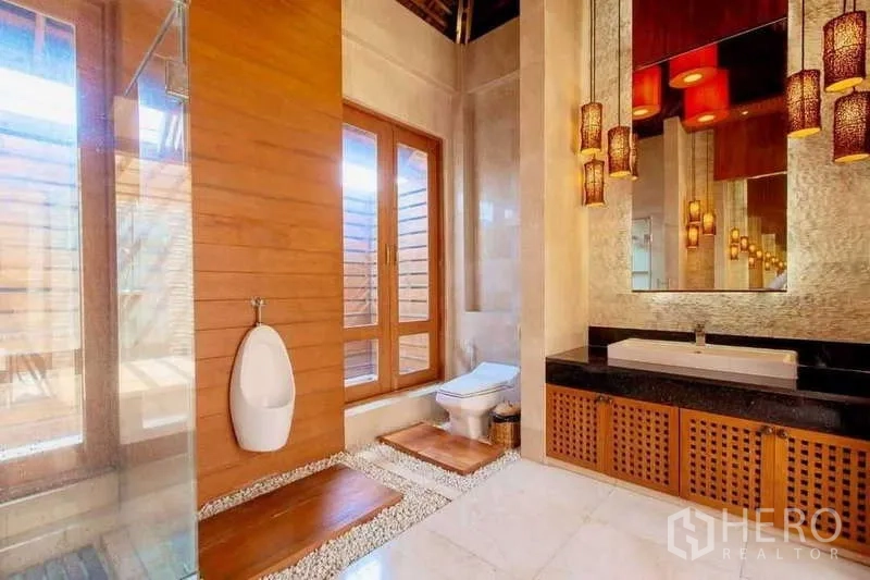 Detached House for sale in Bueng Kum, Bangkok - Stylish bathroom with wood accents, large mirror, pendant lights and glass shower.