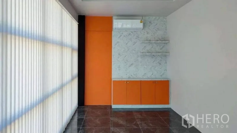 Factory for sale in Bang Pakong, Chachoengsao - Bright office room with vertical blinds and built-in cabinets