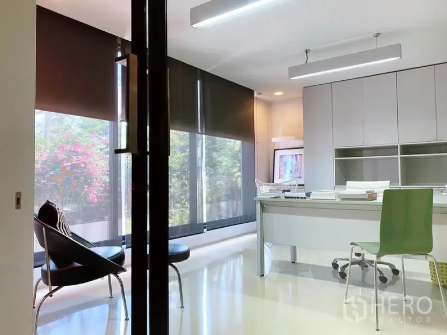 Office Space for rent in Phaya Thai, Bangkok - Private office with large windows, blackout roller blinds, minimalist desk, and overhead linear lights.