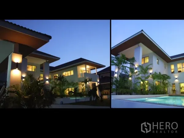 บ้าน ให้เช่าในKhan Na Yao, Bangkok - ภาพภายนอกวิลล่าทันสมัยในกรุงเทพฯ ยามสนธยา หลังคาปีกกว้าง แสงไฟอบอุ่น และสวนริมสระ