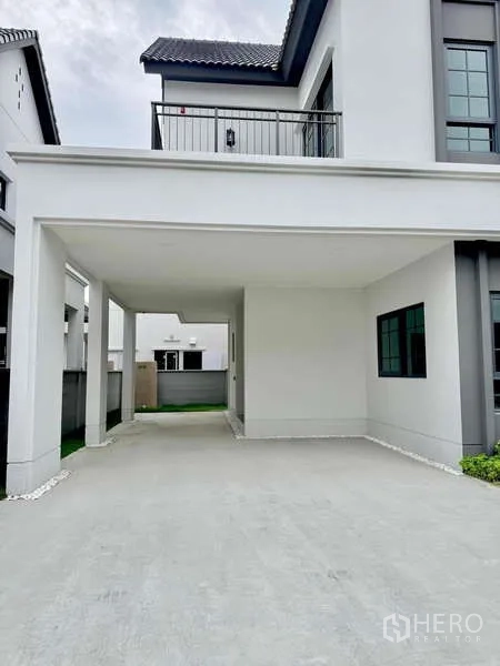 Detached House for sale in Bang Phli, Samut Prakan - Covered two-car carport with long driveway.