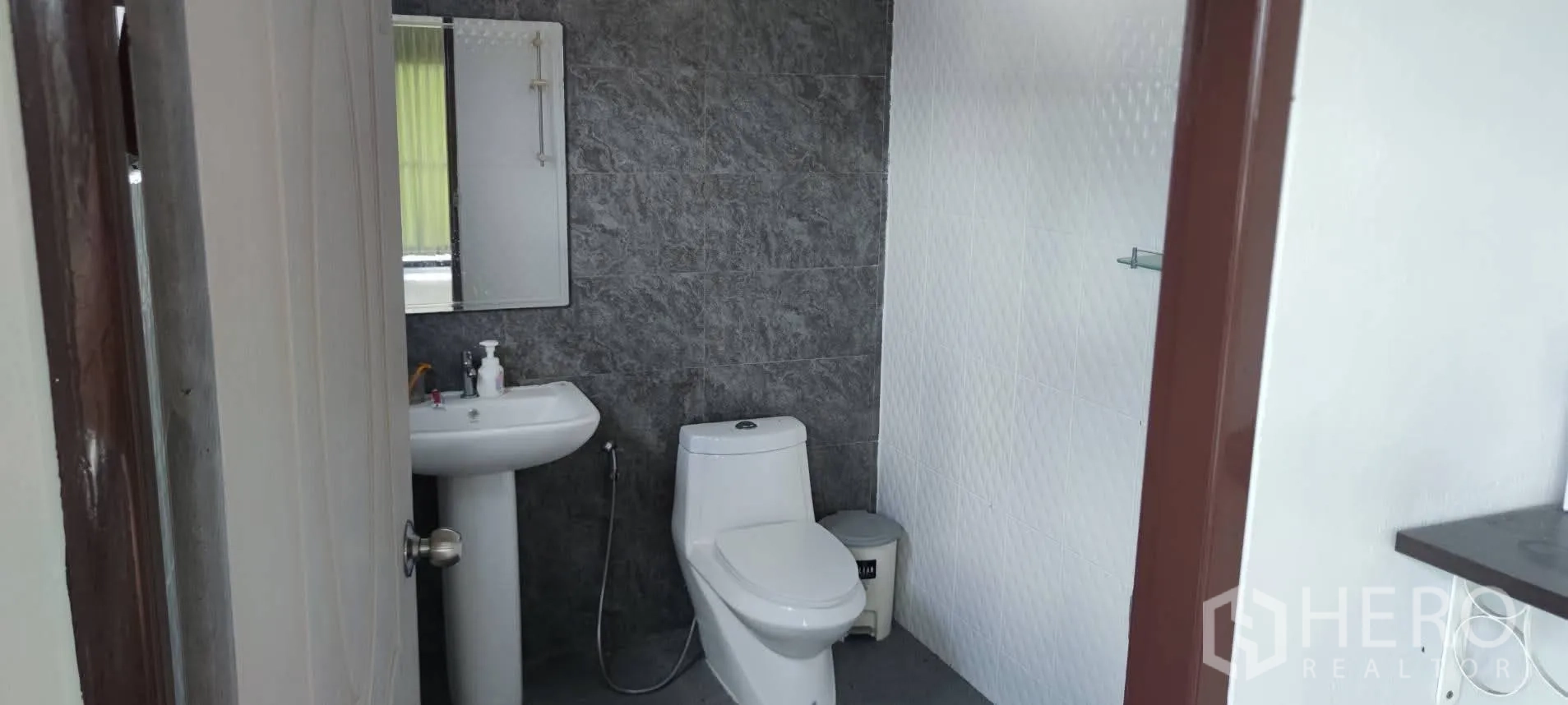 Warehouse for sale in Thung Khru, Bangkok - Tiled bathroom with pedestal sink and toilet.