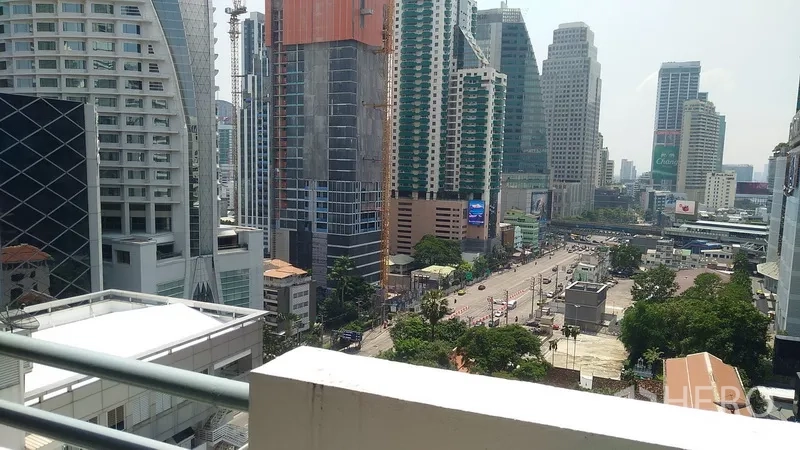 Condominium for sale in Watthana, Bangkok - City view over Asok intersection and Sukhumvit high-rises from the condo balcony.