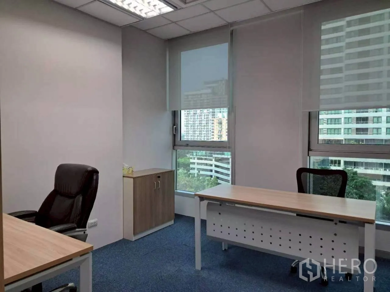 Office Space for rent in Sathon, Bangkok - Manager’s office with executive chair, storage cabinet and expansive windows.