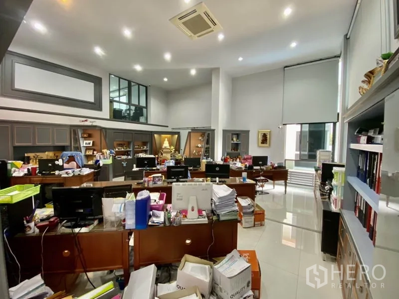 Home Office for rent or sale in Yan Nawa, Bangkok - Spacious open-plan office with high ceilings, multiple desks, and built-in shelving.