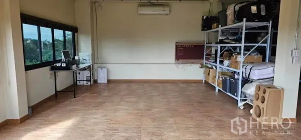 Warehouse for rent in Bang Kruai, Nonthaburi - Storage or workroom with shelving, large windows and air-conditioning.