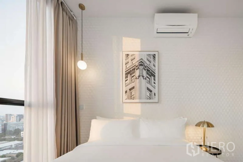 Condominium for rent - Bedroom detail showing pendant light, wall art, air conditioner and full-height curtains.