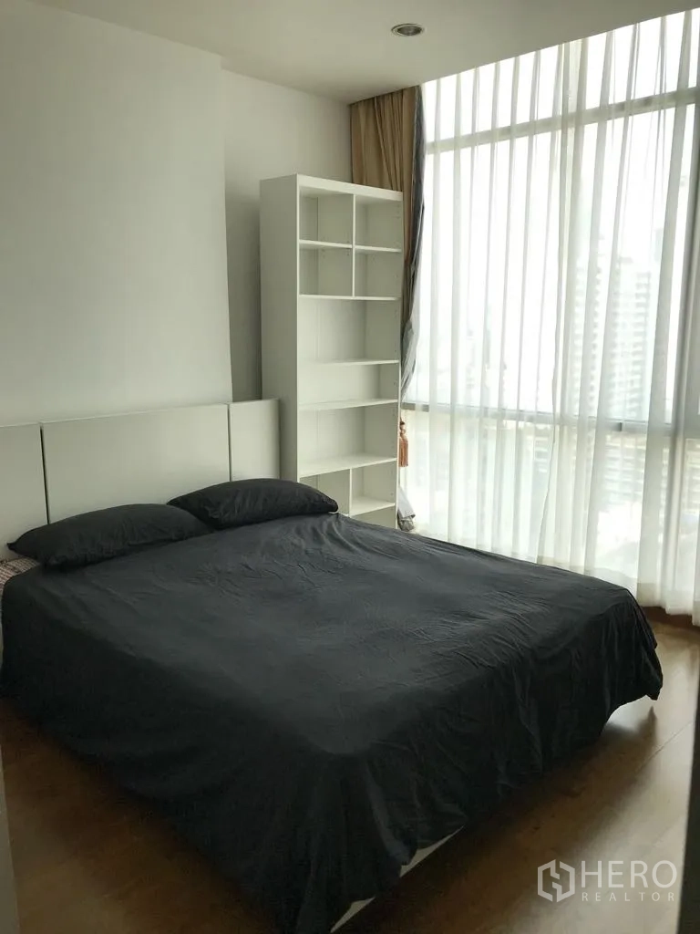 Condominium for rent in Watthana, Bangkok - Second bedroom with floor-to-ceiling windows, sheer curtains and city view