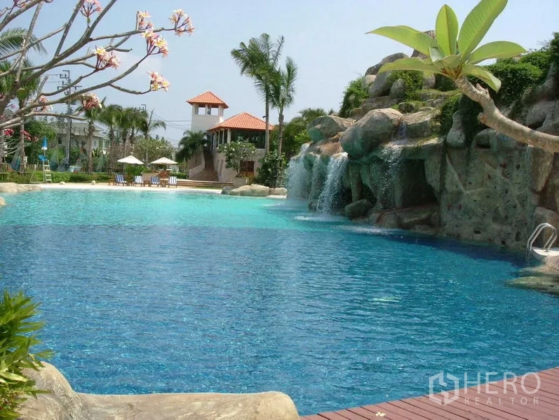 Detached House for rent in Prawet, Bangkok - Resort-style communal swimming pool with rock waterfall and sun deck.