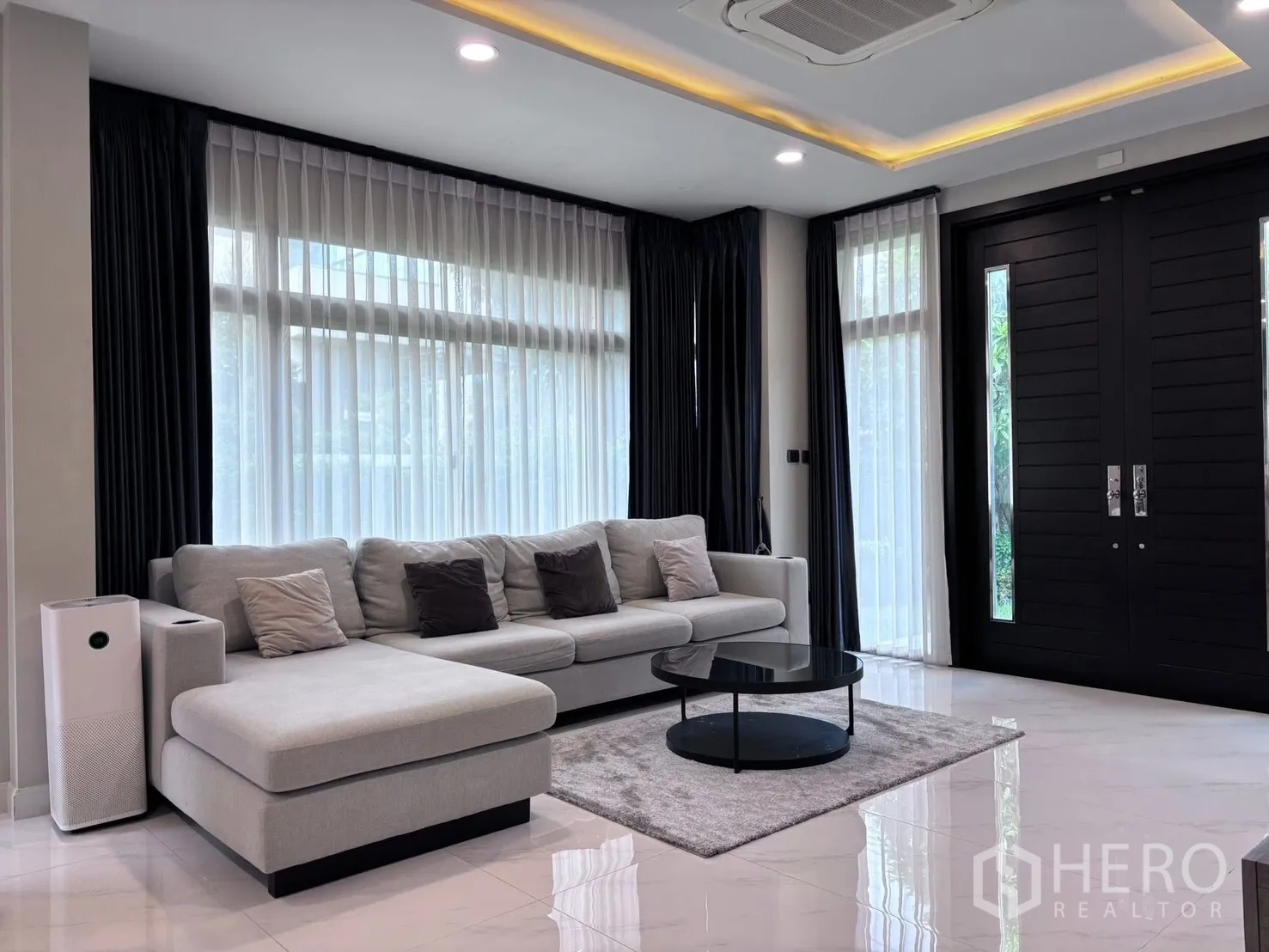 Detached House for rent in Bang Phli, Samut Prakan - Covered side terrace with storage doors and tiled floor.