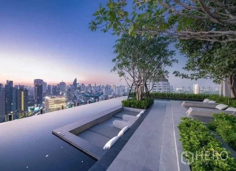 Condominium for rent in Watthana, Bangkok - Rooftop infinity pool terrace with sunken seating and skyline views.