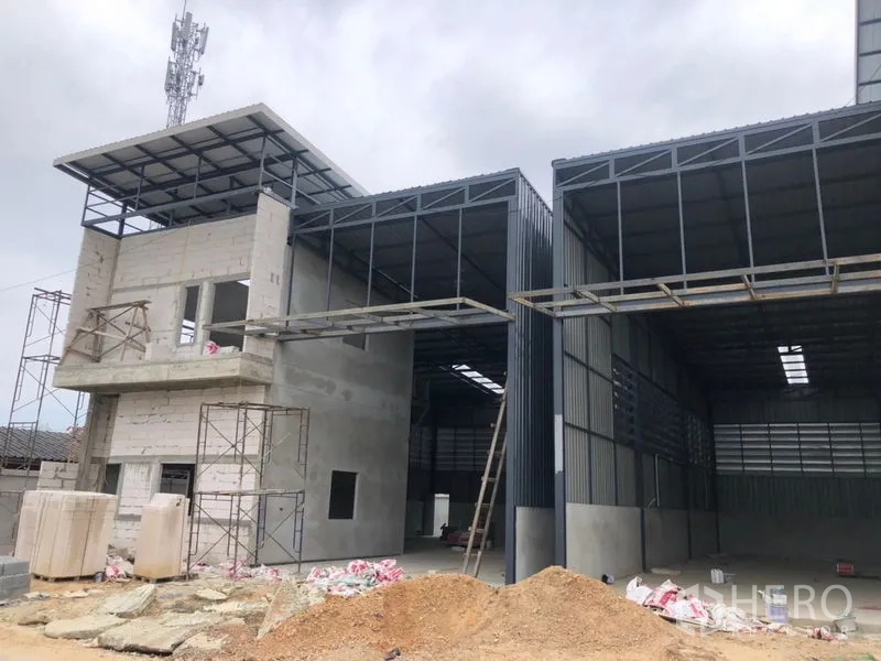 คลังสินค้า ให้เช่าในLam Luk Ka, Pathum Thani - โกดังสองยูนิตพร้อมพื้นที่โหลดสินค้าและโครงเหล็กกำลังก่อสร้าง