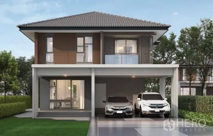 บ้าน ให้เช่าหรือขายในLam Luk Ka, Pathum Thani - มุมมองด้านหน้าบ้านเดี่ยวสองชั้นร่วมสมัย มีระเบียงและทางจอดรถ 2 คัน