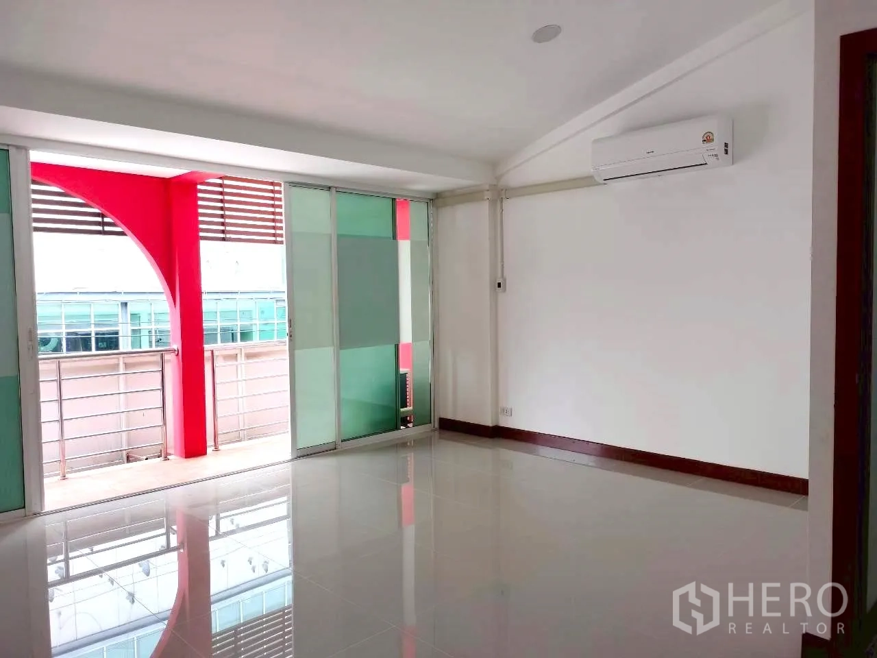 Home Office for rent in Watthana, Bangkok - Upper floor room opening to a balcony with frosted glass sliding panels.