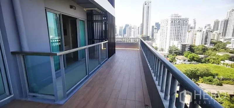 Condominium for rent in Watthana, Bangkok - Spacious balcony with wood-look flooring and panoramic city skyline views in Phrom Phong.