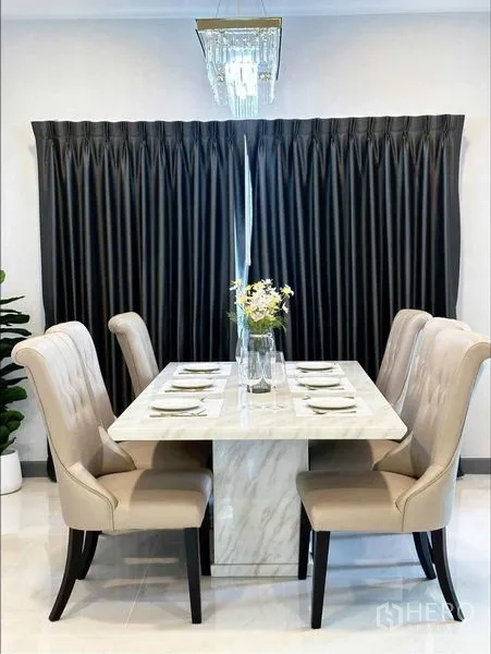 Detached House for rent or sale in Bang Phli, Samut Prakan - Elegant dining area with marble-top table, six upholstered chairs and chandelier.