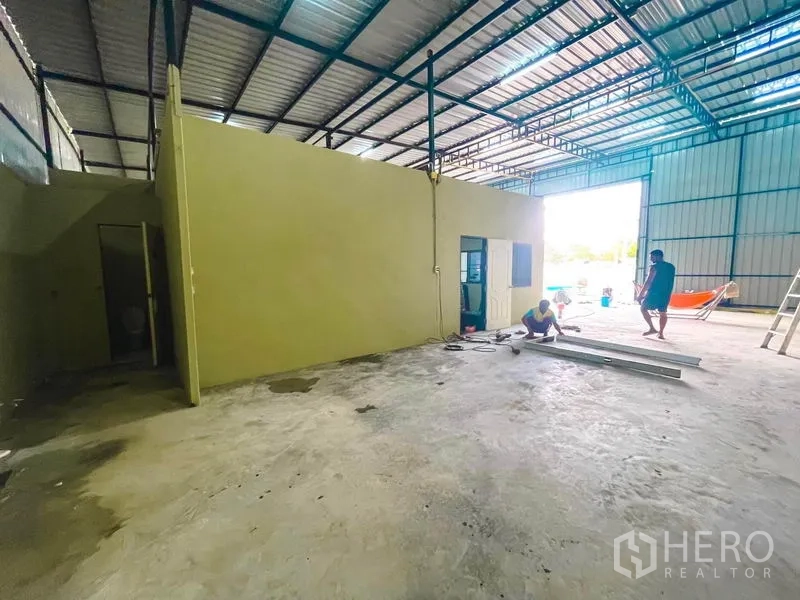 Warehouse for rent in Sai Mai, Bangkok - Office block with door and bathroom area near the loading entrance inside the warehouse.