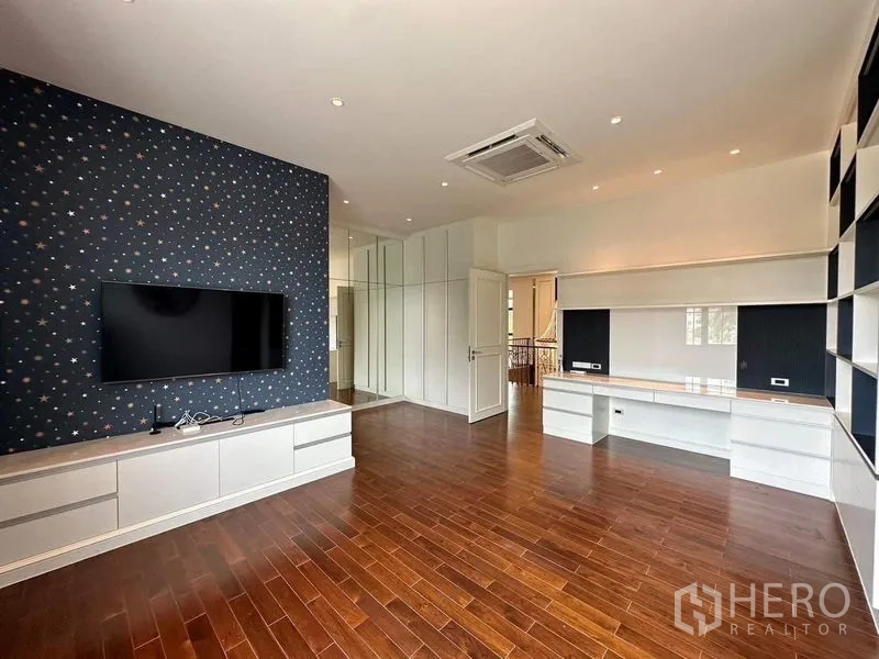 Detached House for sale - Versatile bedroom or study with TV wall, built-in desks and shelving.