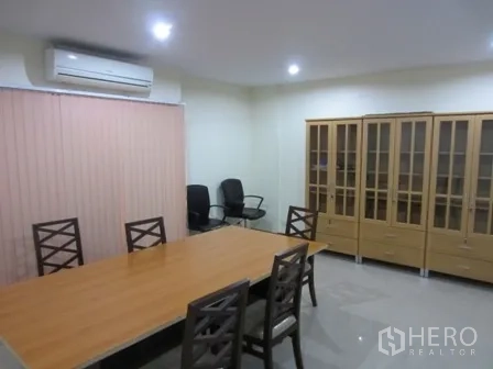 Home Office for rent or sale in Wang Thonglang, Bangkok - Meeting room with long conference table, chairs and display cabinets.