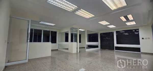 Office Space for rent in Bueng Kum, Bangkok - Open-plan office floor with glass partitions and fluorescent ceiling lights.