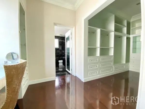 Detached House for rent in Bang Phli, Samut Prakan - Walk-in closet with built-in cabinets and a doorway to a marble bathroom