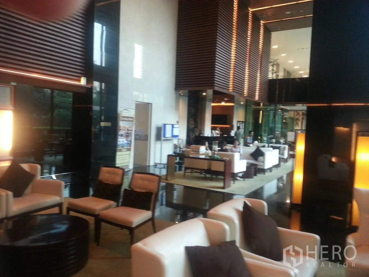 Condominium for rent or sale in Bang Rak, Bangkok - Stylish lobby with lounge seating and high ceilings.