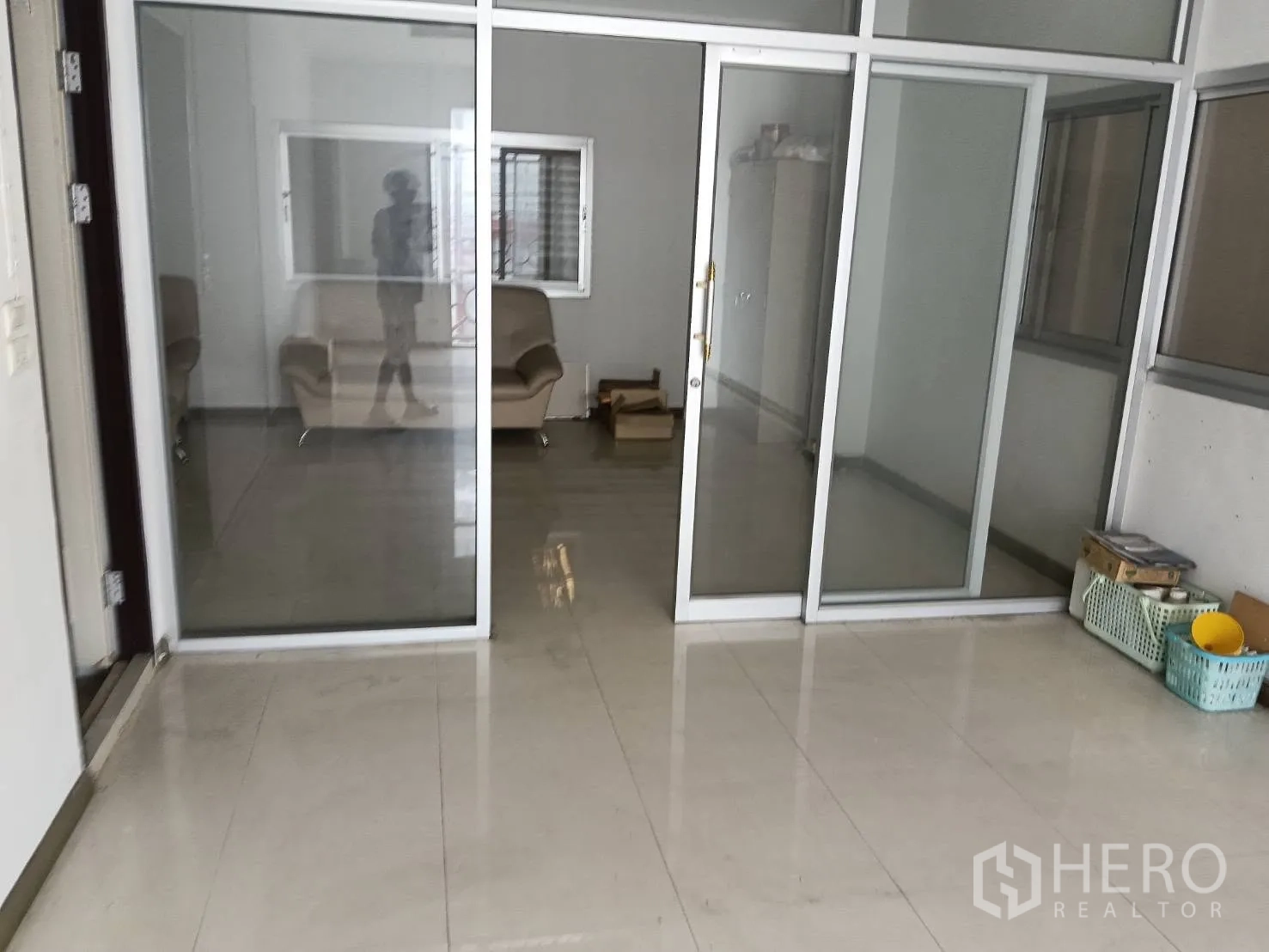 Factory for rent or sale in Bang Phae, Ratchaburi - Glass-partitioned office with sliding doors, tiled floor, and seating.