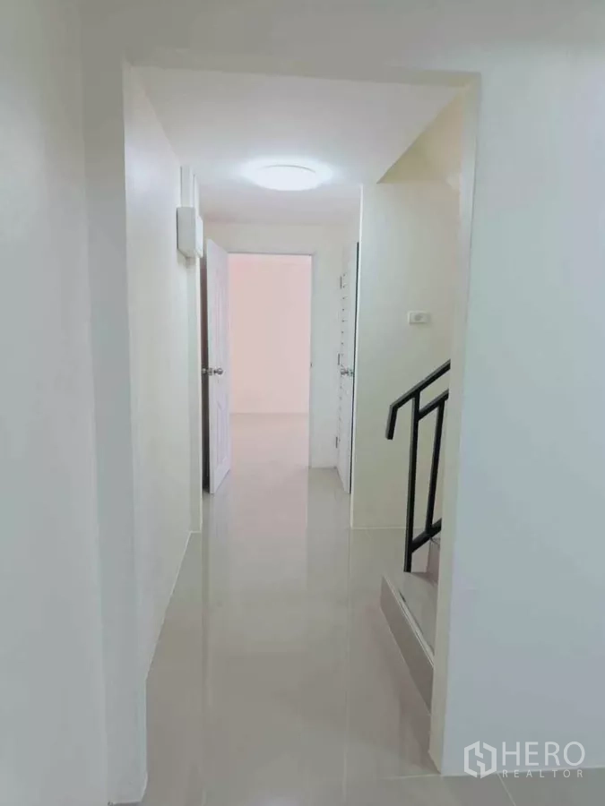 Home Office for rent in Bang Phli, Samut Prakan - Hallway with staircase and doors leading to office rooms.